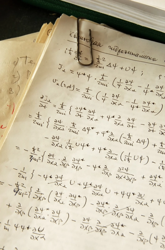 et stykke papir med en masse matematiske formler på